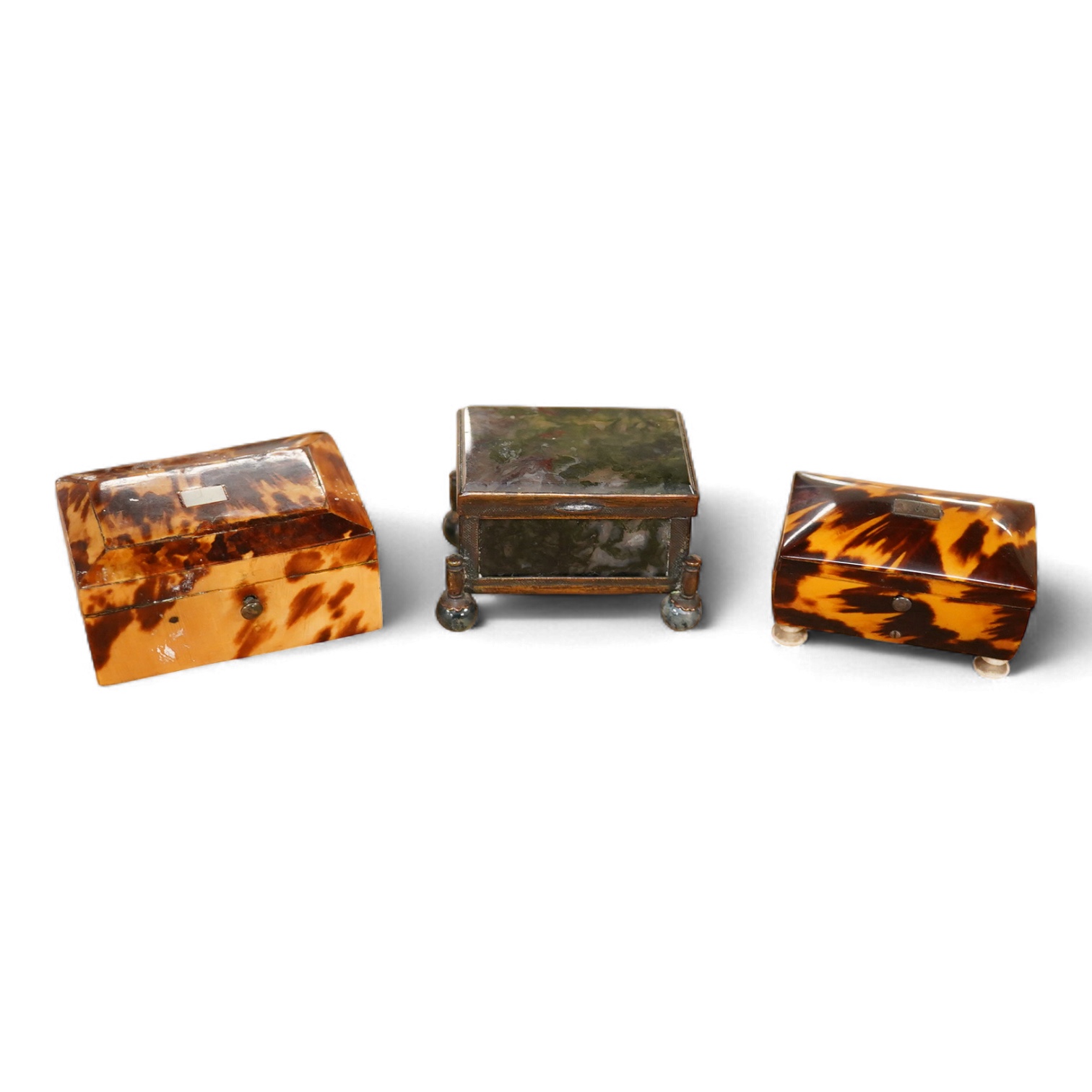 A 19th century miniature brass and agate trinket box and two early 19th century tortoiseshell needle boxes, largest 5.5cm wide x 2.5cm high